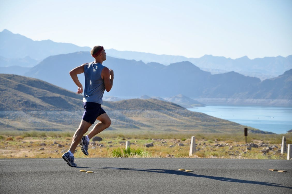 An image of a man running on the side of the road
