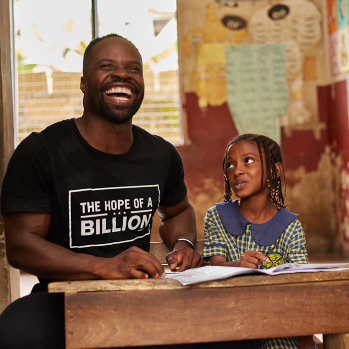 Akwasi Frimpong encouraging a child in Africa
