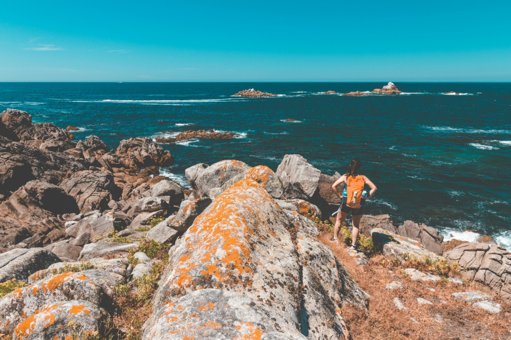 A girl standing by the sea
