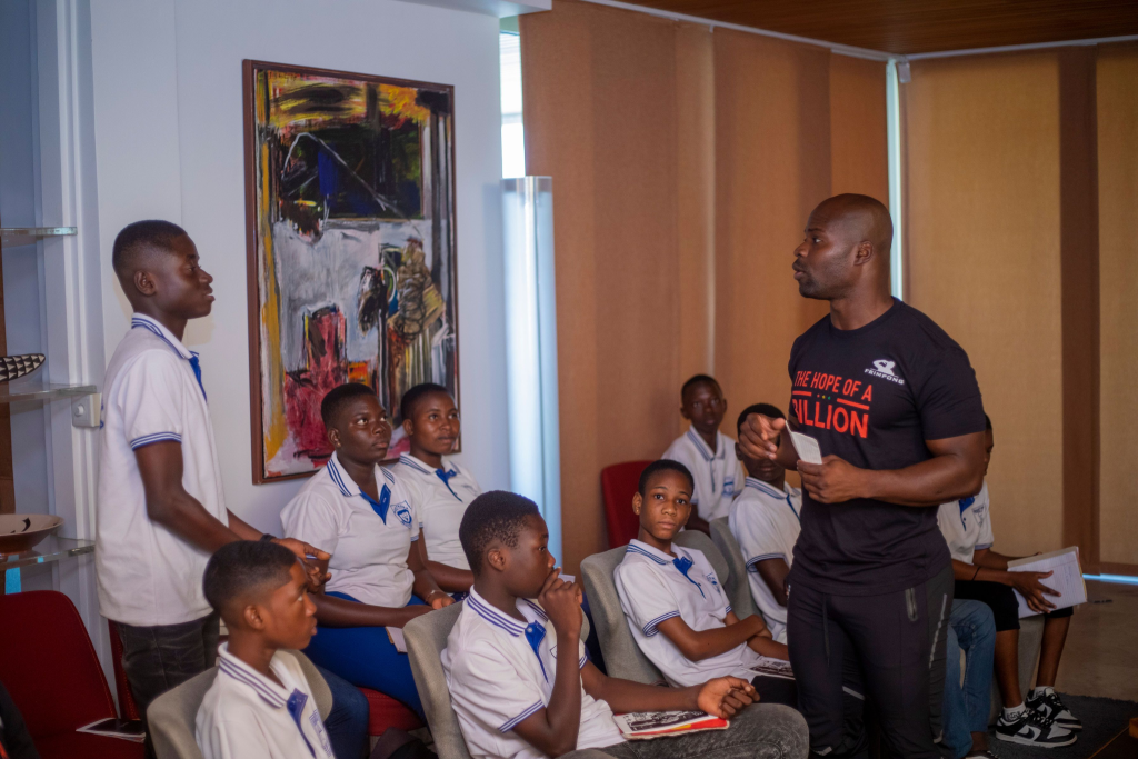 Akwasi Frimpong addressing a group of kids