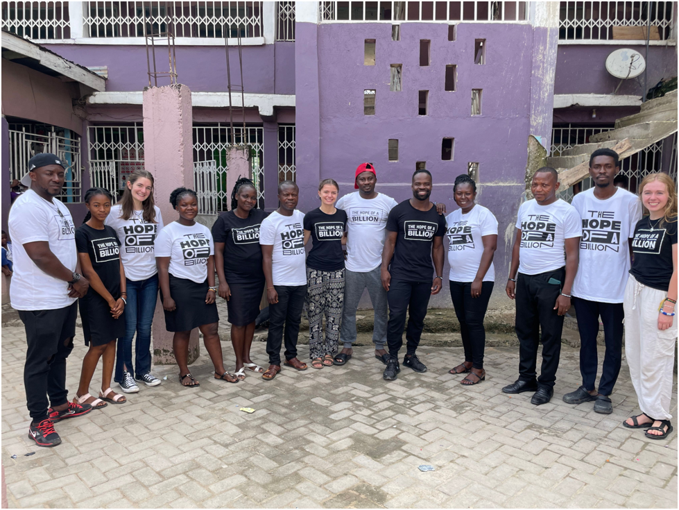 A diverse group wearing t-shirts with "THE HOPE FOR A BILLION" text