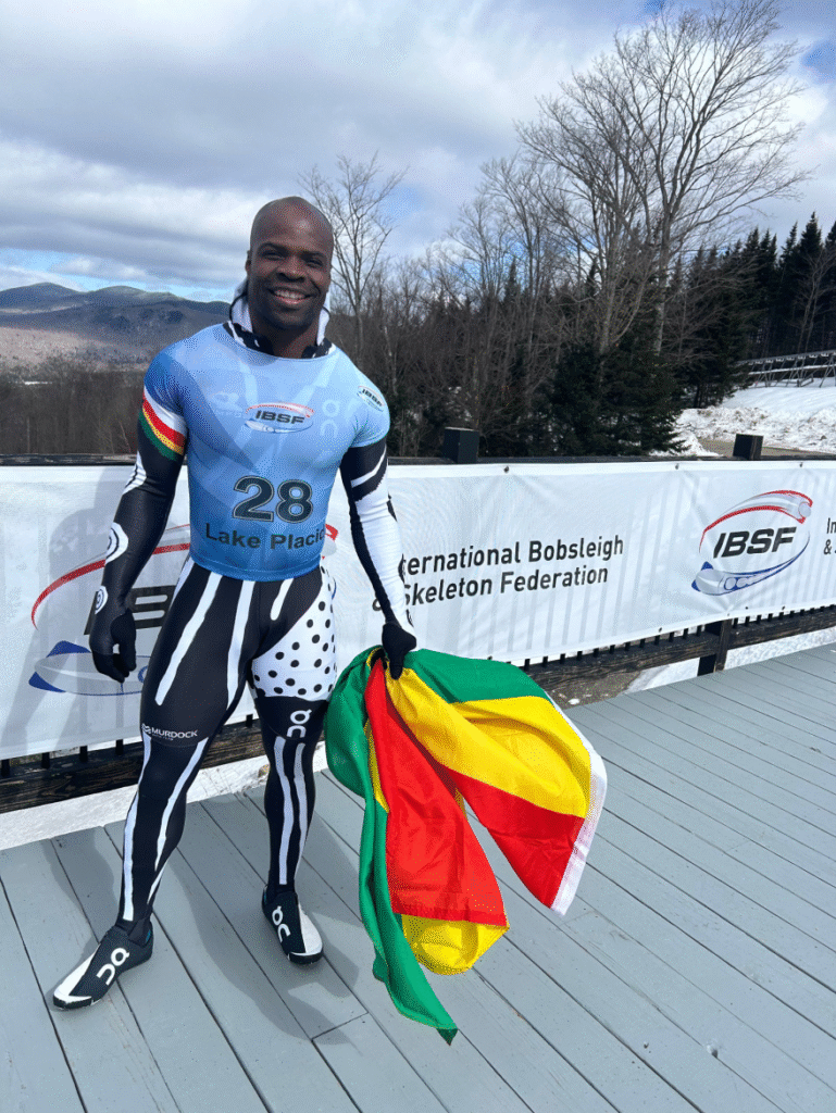 Akwasi Frimpong holding a flag