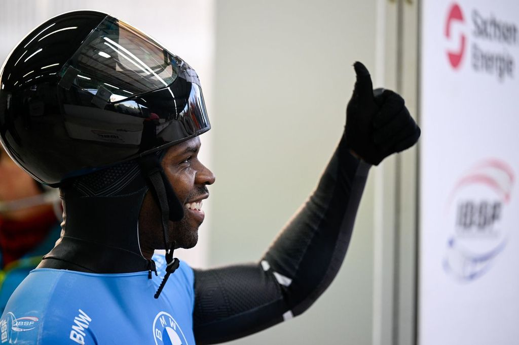 Akwasi Frimpong wearing a helmet and doing a thumbs up