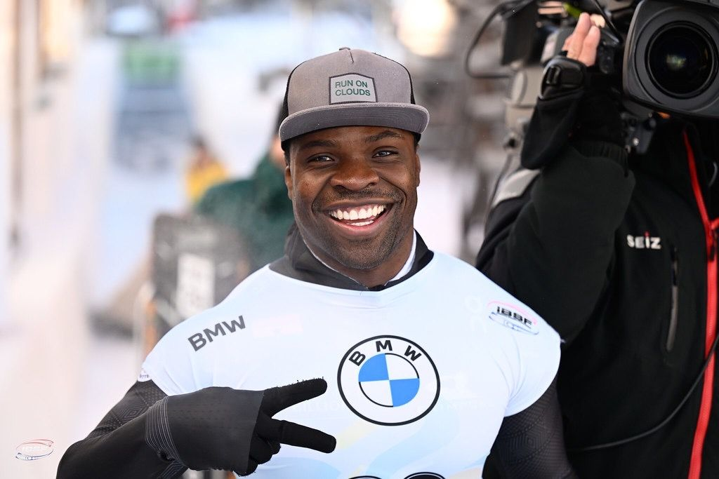  Akwasi Frimpong smiling in his skeleton racing suit during a Winter Olympics event