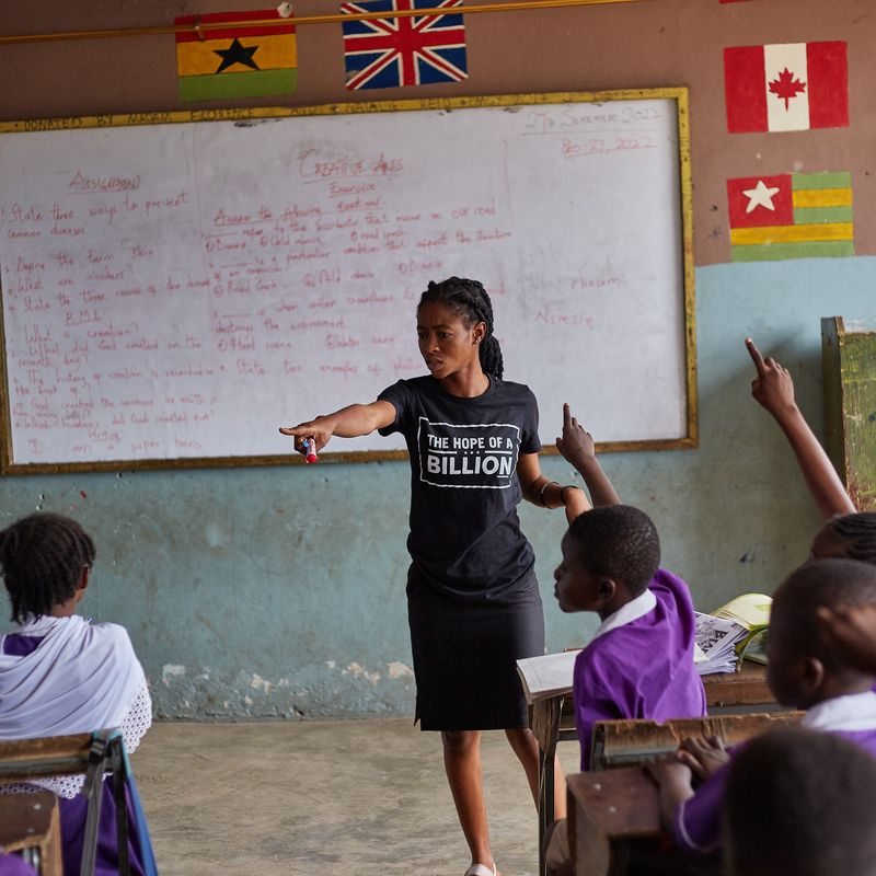 Teacher leading students in a classroom during a Hope Of A Billion program.